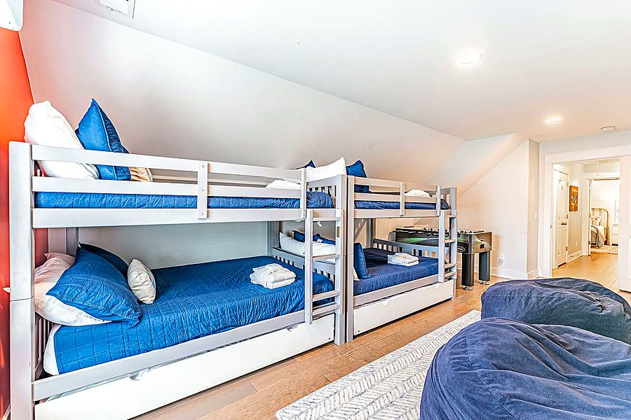 Bunk room with two full-over-full bunks and twin trundles