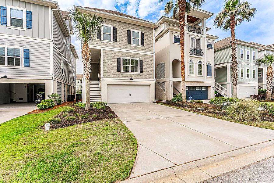 Front of 122 Sandcastle Court with the driveway and garage