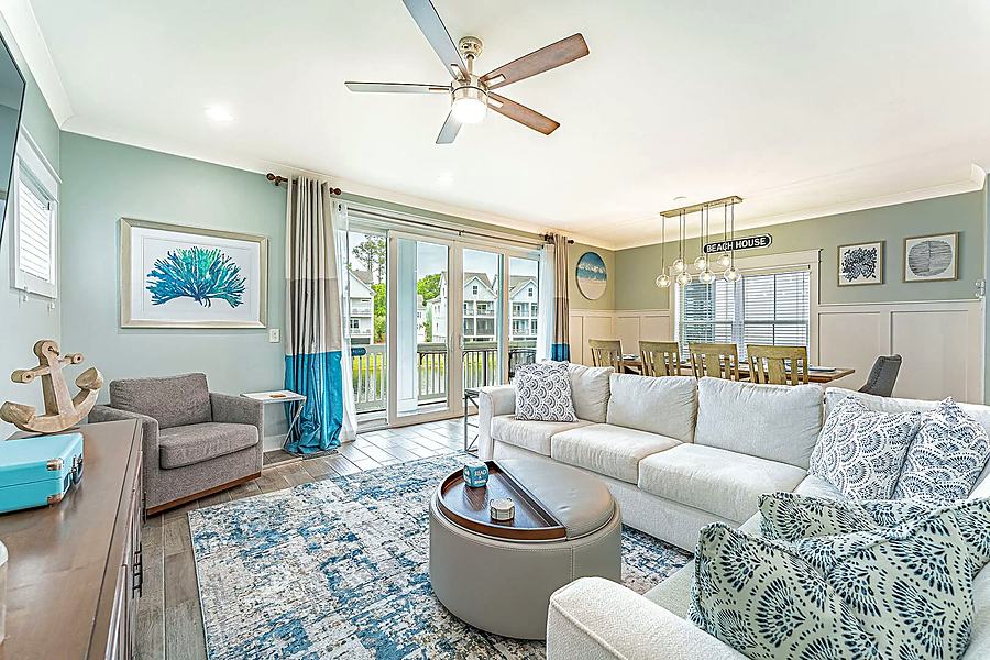 Living room sectional and doors to the porch