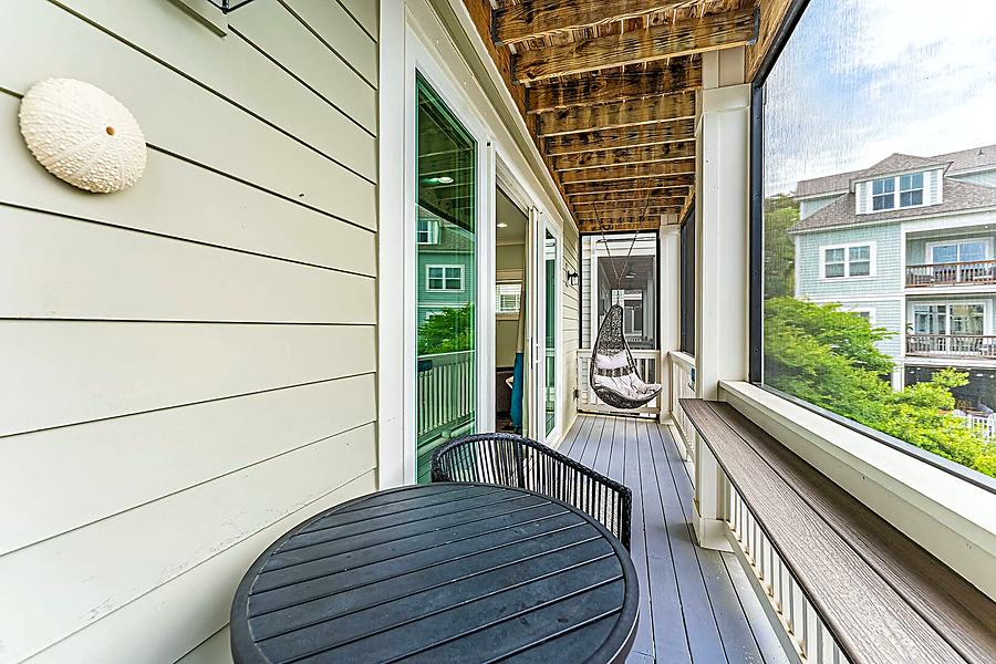 Screened porch with a swing