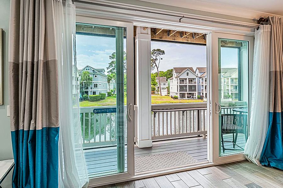 Sliding doors from the living room to the screened porch