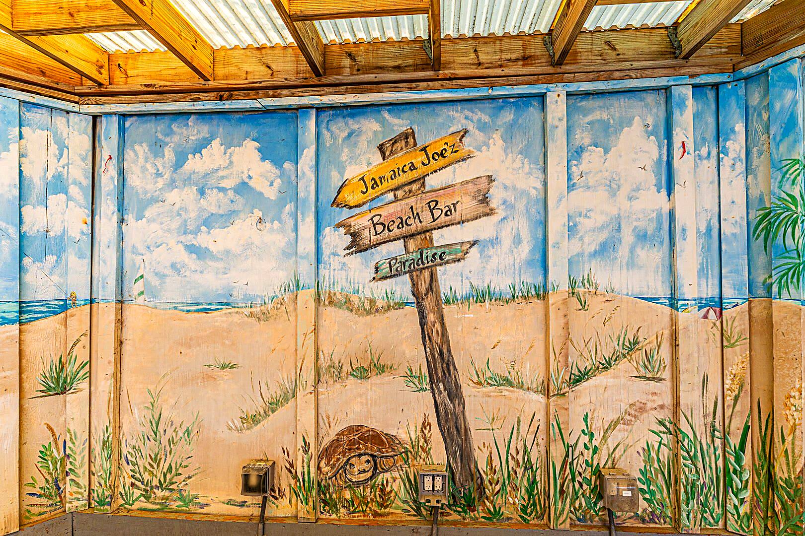 Hand-painted beach mural inside Jamaica Joe'z oceanfront beach bar near Folly Field Beach, Hilton Head Island